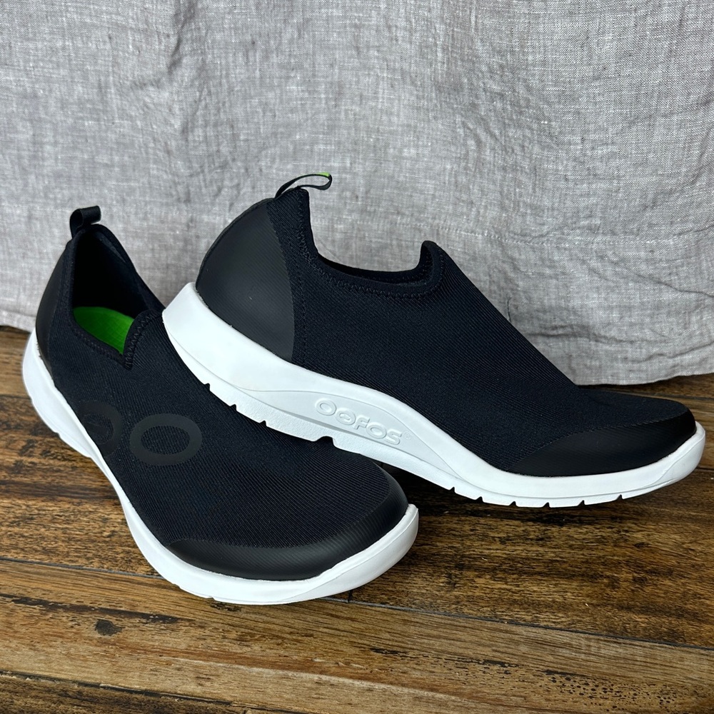 OOFOS Women’s Black and White Slip-On Sneakers